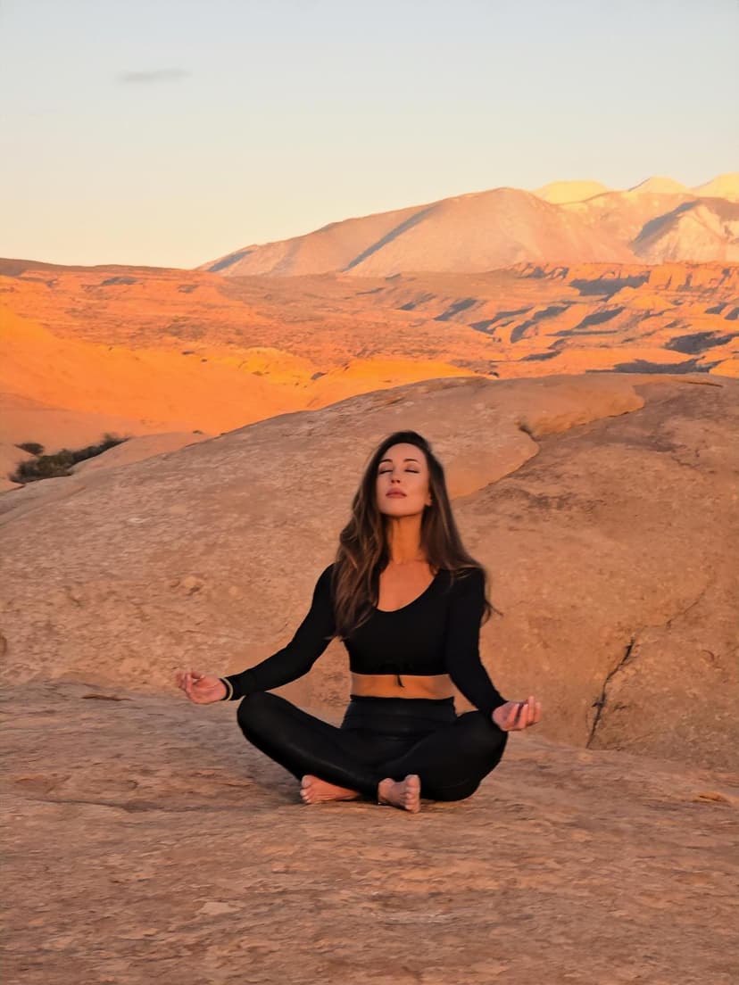MJ Grace meditating at golden hour